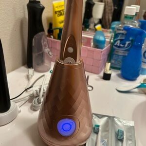 Fancy self sanitizing electric toothbrush